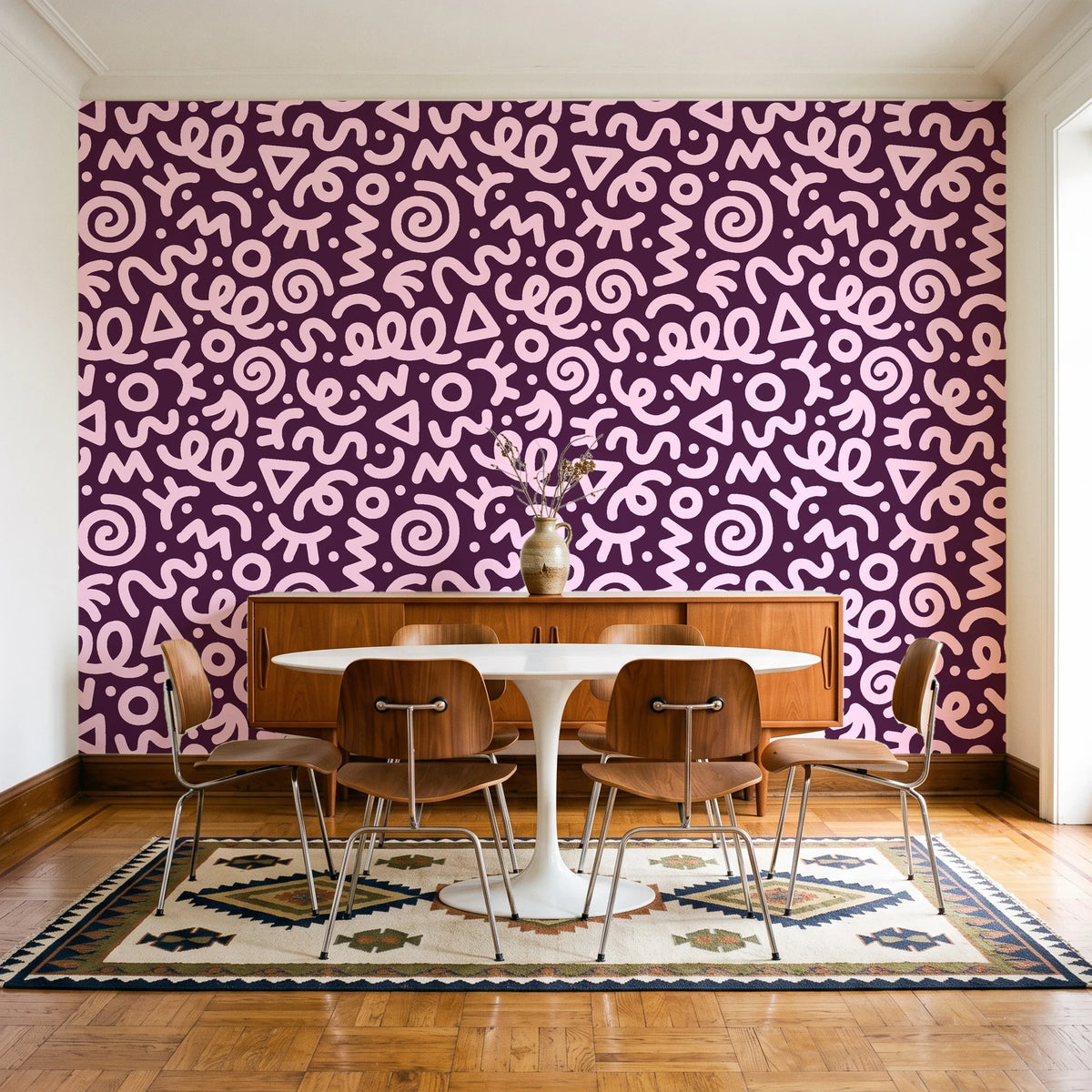 Scribble Pop Mulberry squiggle wallpaper in a mid-century dining room with a teak sideboard and tulip table