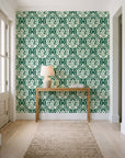 Secret Arbor Emerald damask wallpaper behind a console table in a light entry hallway