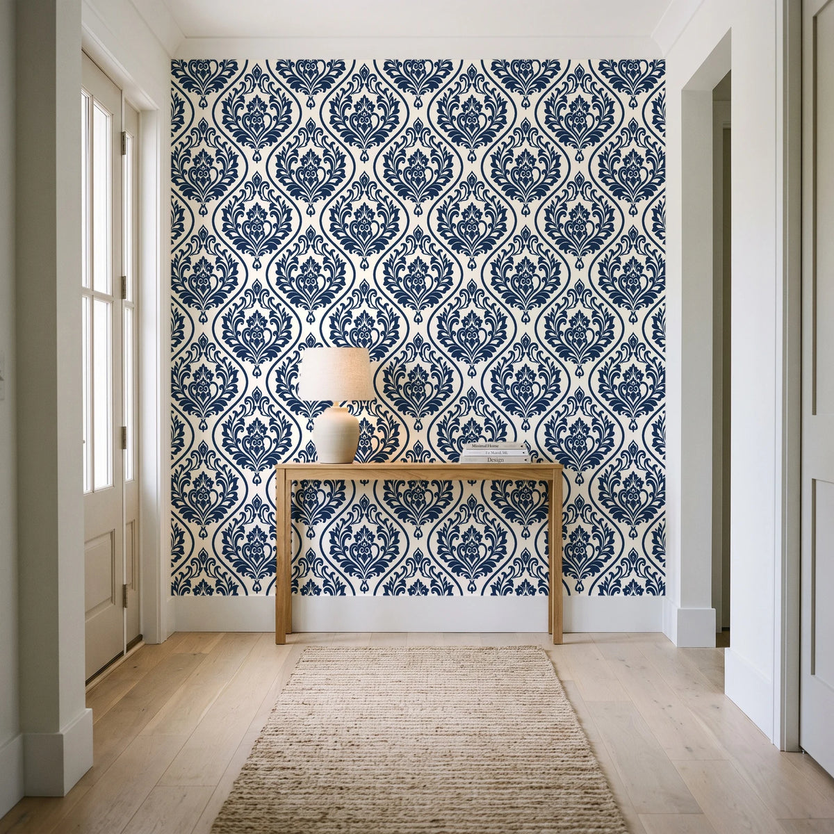 Secret Arbor Midnight damask wallpaper behind a console table in a light entry hallway