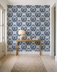 Secret Arbor Midnight damask wallpaper behind a console table in a light entry hallway