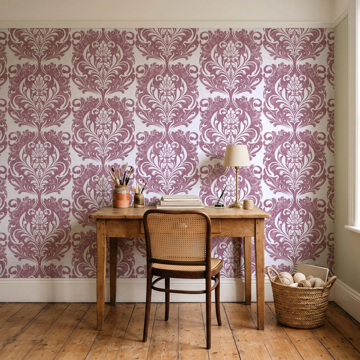 Serene Blossom Rose damask wallpaper behind a vintage writing desk in a cozy craft-room home office