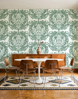 Serene Blossom Sage damask wallpaper in a mid-century dining room with a teak sideboard and tulip table
