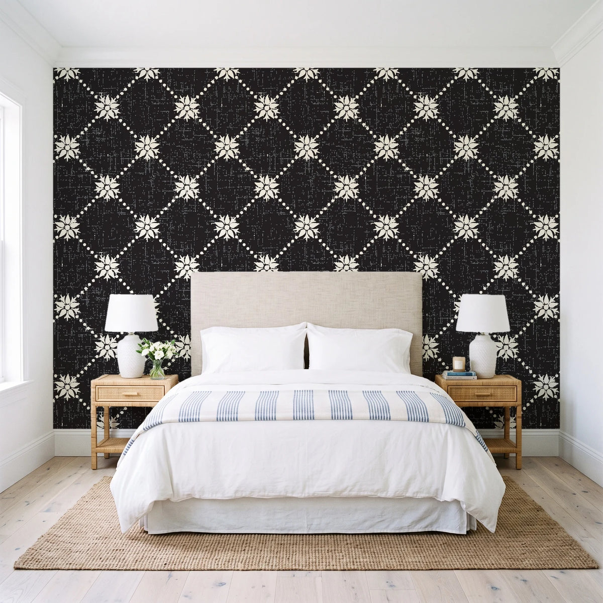 Shadow Garden Onyx lattice floral wallpaper behind a queen bed in a bright coastal bedroom