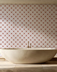 Shadow Garden Terracotta lattice floral wallpaper creating ambiance in a serene spa bathroom