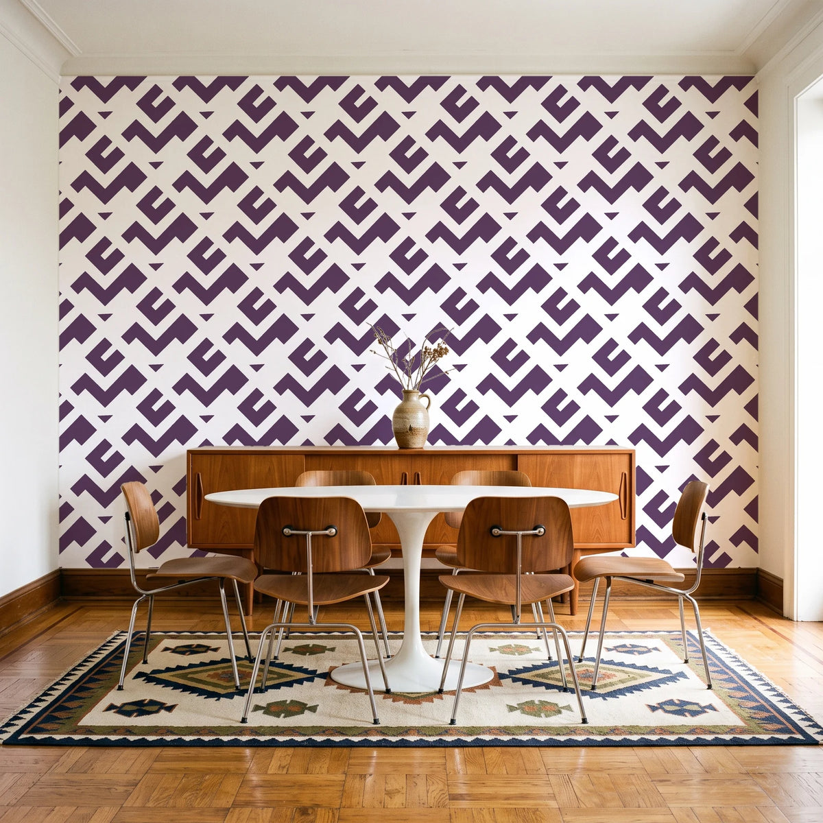 Signal & Edge Plum geometric wallpaper in a mid-century dining room with a teak sideboard and tulip table