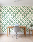 Signal & Edge Sage geometric wallpaper behind a modern oak desk in a bright home office