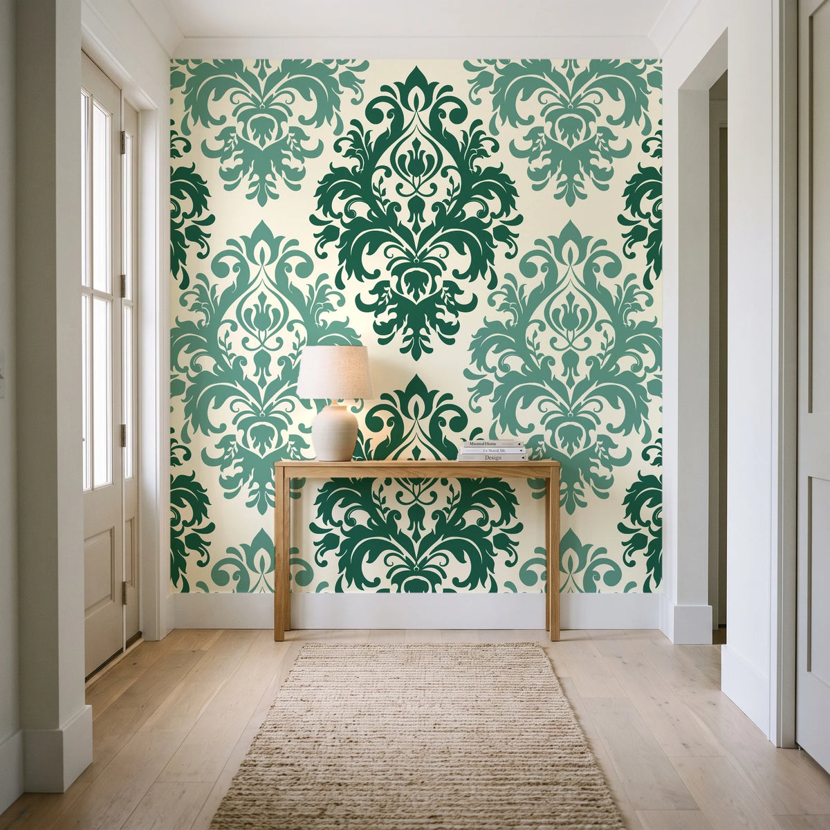 Silent Bouquet Emerald damask wallpaper behind a console table in a light entry hallway
