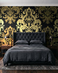 Silent Bouquet Noir damask wallpaper behind a tufted headboard in a dark, moody bedroom