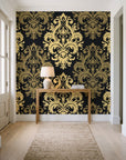 Silent Bouquet Noir damask wallpaper behind a console table in a light entry hallway
