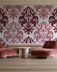 Silent Bouquet Oxblood damask wallpaper in a boutique hotel sitting area