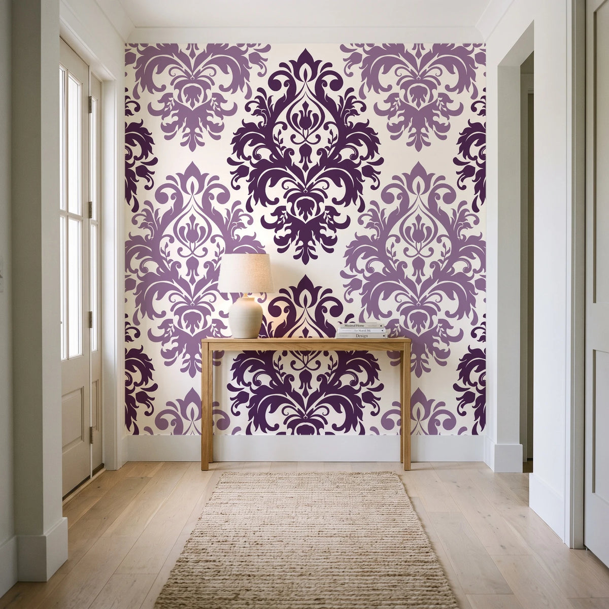 Silent Bouquet Plum damask wallpaper behind a console table in a light entry hallway