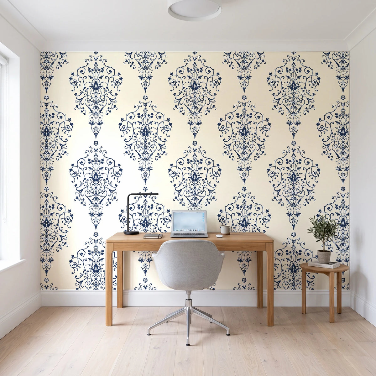 Silent Spring Navy damask wallpaper behind a modern oak desk in a bright home office