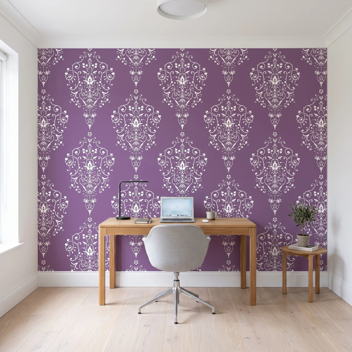 Silent Spring Plum damask wallpaper behind a modern oak desk in a bright home office