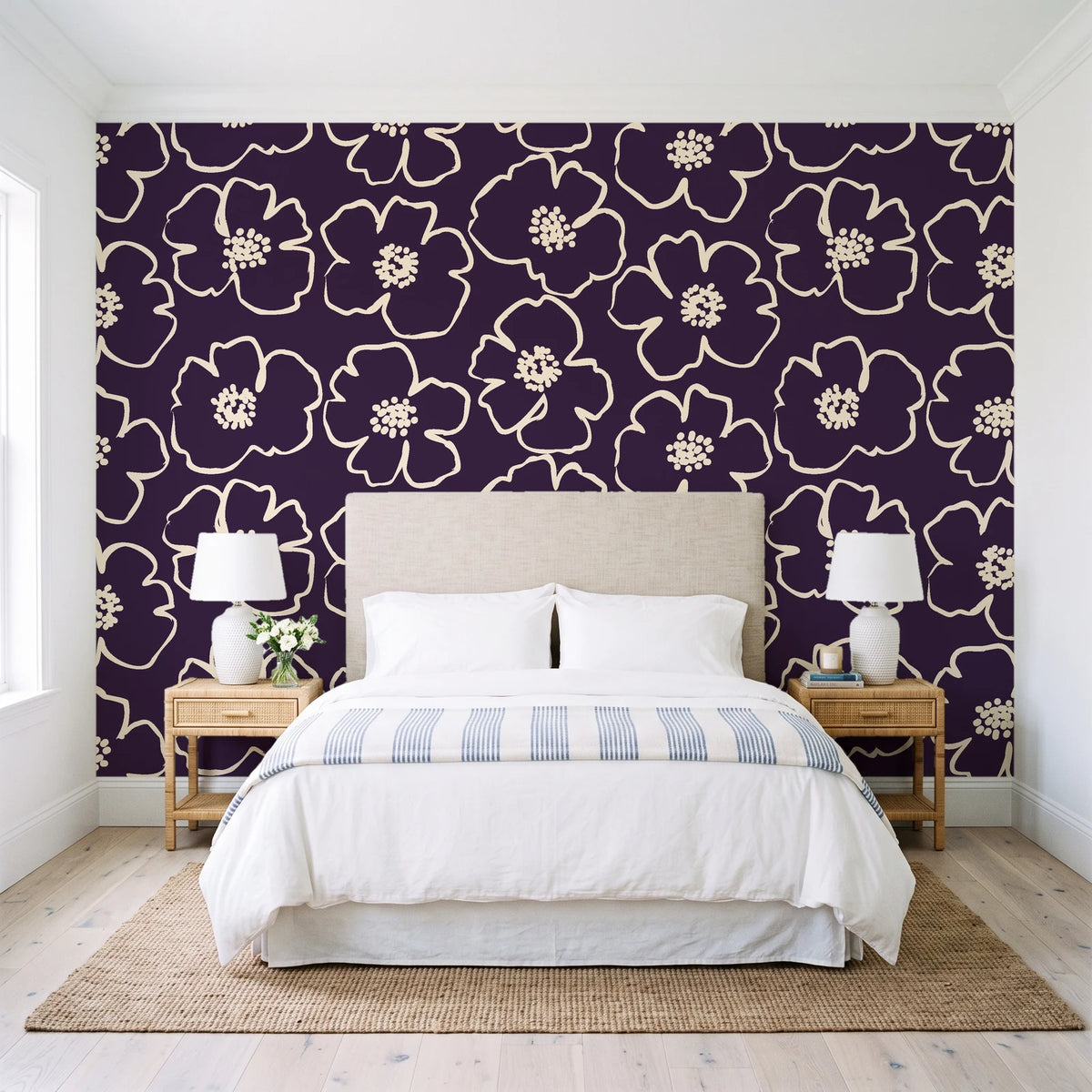 Sketch Anemone Aubergine sketched anemone wallpaper behind a queen bed in a bright coastal bedroom
