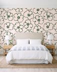 Sketch Anemone Fern sketched anemone wallpaper behind a queen bed in a bright coastal bedroom