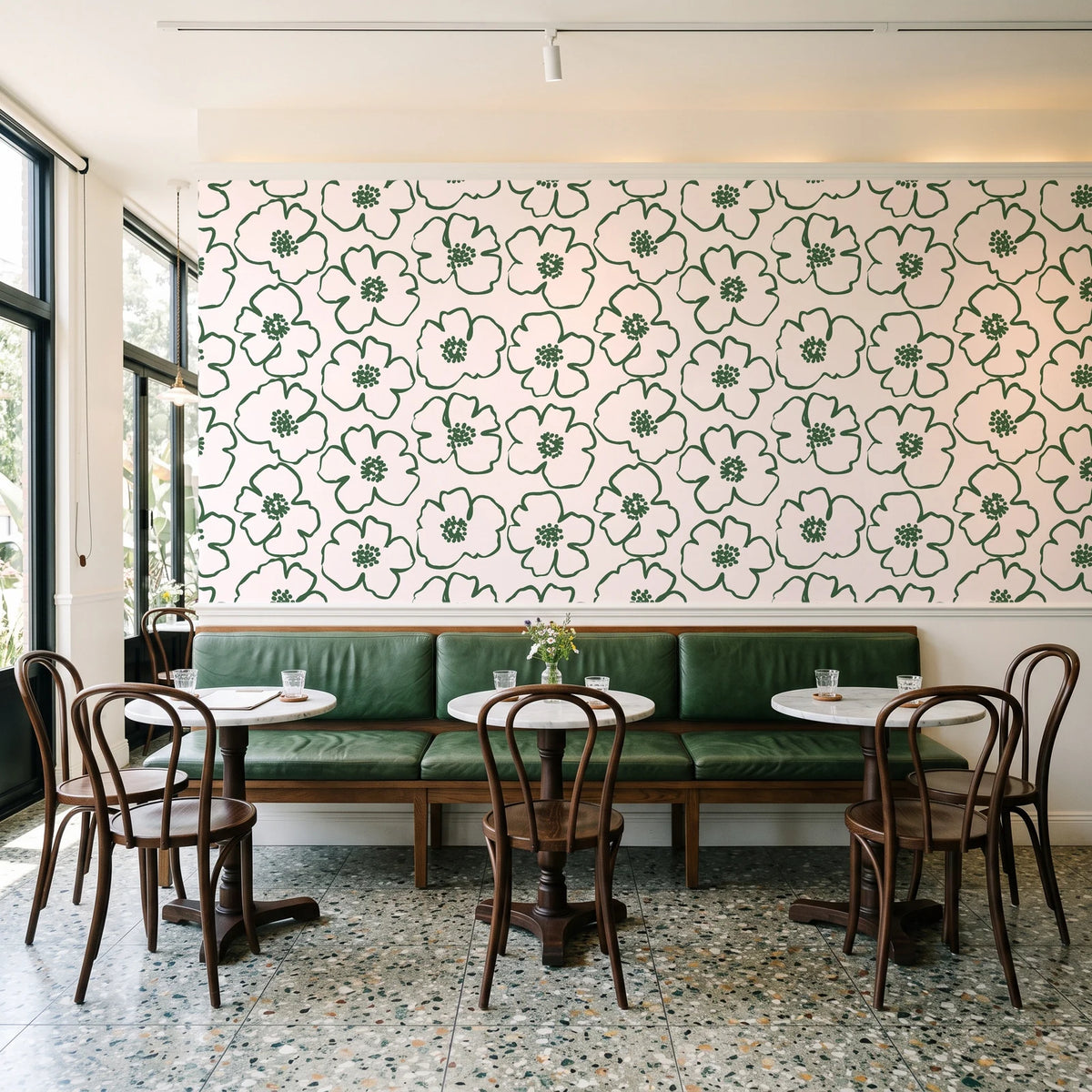 Sketch Anemone Fern sketched anemone wallpaper above a green leather banquette in a sunlit neighborhood cafe