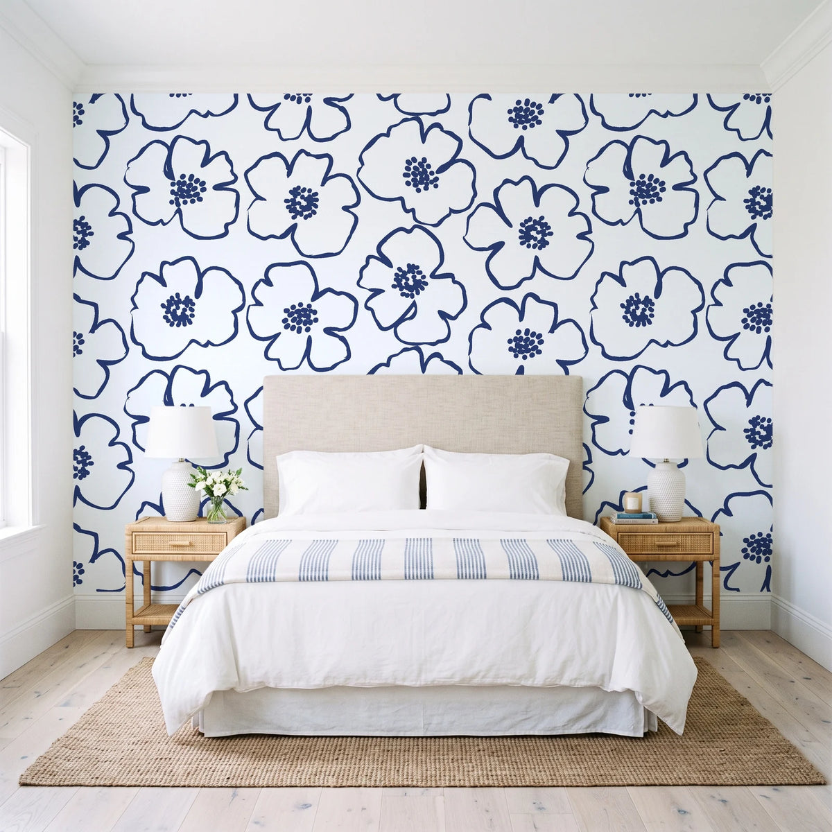 Sketch Anemone Indigo sketched anemone wallpaper behind a queen bed in a bright coastal bedroom