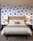 Sketched Seashells Plum seashell wallpaper behind the headboard of a king bed in a contemporary hotel guest room