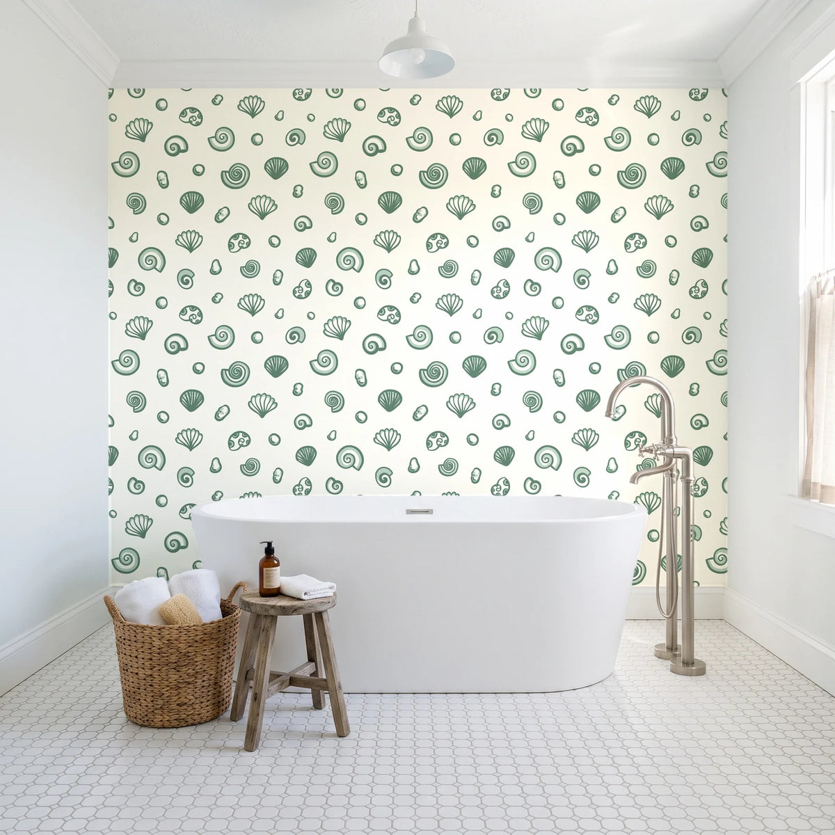 Sketched Seashells Sage seashell wallpaper behind a freestanding tub in a bright coastal bathroom