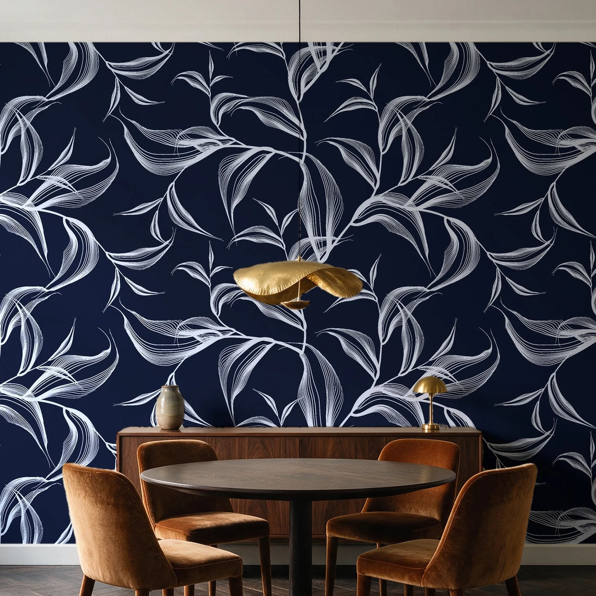 Sketched Silence Midnight line art leaf wallpaper behind a walnut credenza and round table in an elegant dining room