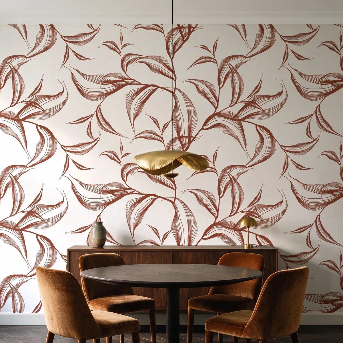 Sketched Silence Rust line art leaf wallpaper behind a walnut credenza and round table in an elegant dining room
