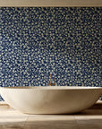Sky Bloom Midnight floral wallpaper creating ambiance in a serene spa bathroom