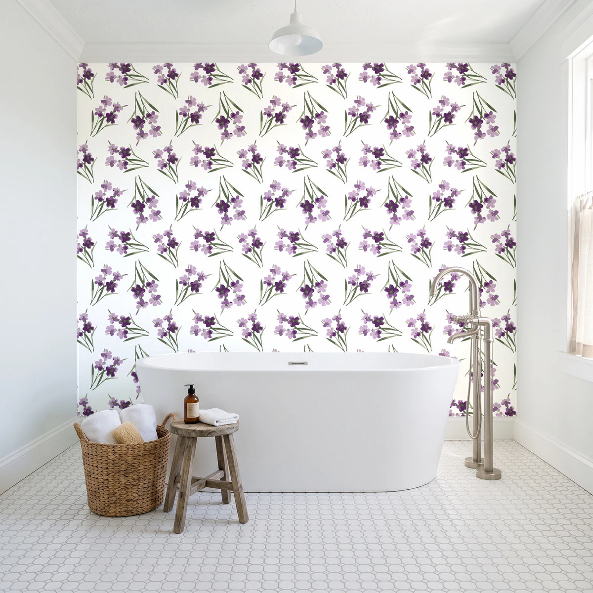 Sky Memory Plum watercolor floral wallpaper behind a freestanding tub in a bright coastal bathroom