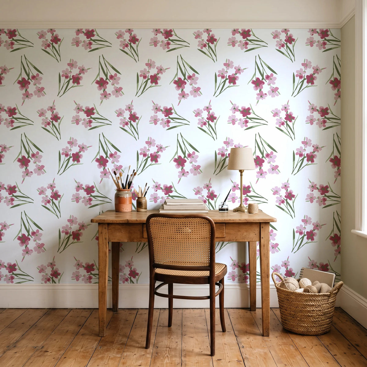 Sky Memory Rosewood watercolor floral wallpaper behind a vintage writing desk in a cozy craft-room home office