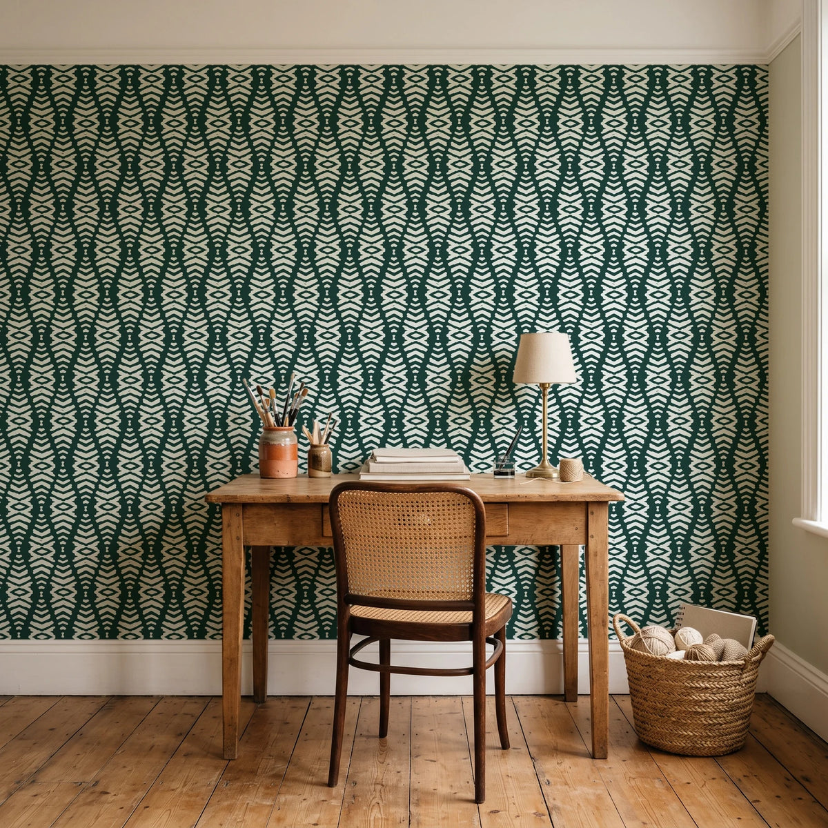 Smoke Ancestry Forest geometric wallpaper behind a vintage writing desk in a cozy craft-room home office
