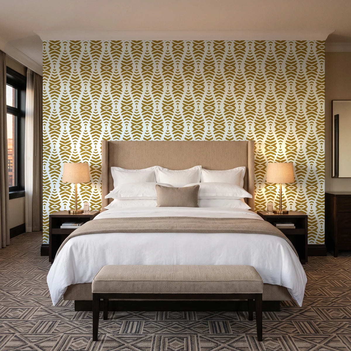 Smoke Ancestry Ochre geometric wallpaper behind the headboard of a king bed in a contemporary hotel guest room