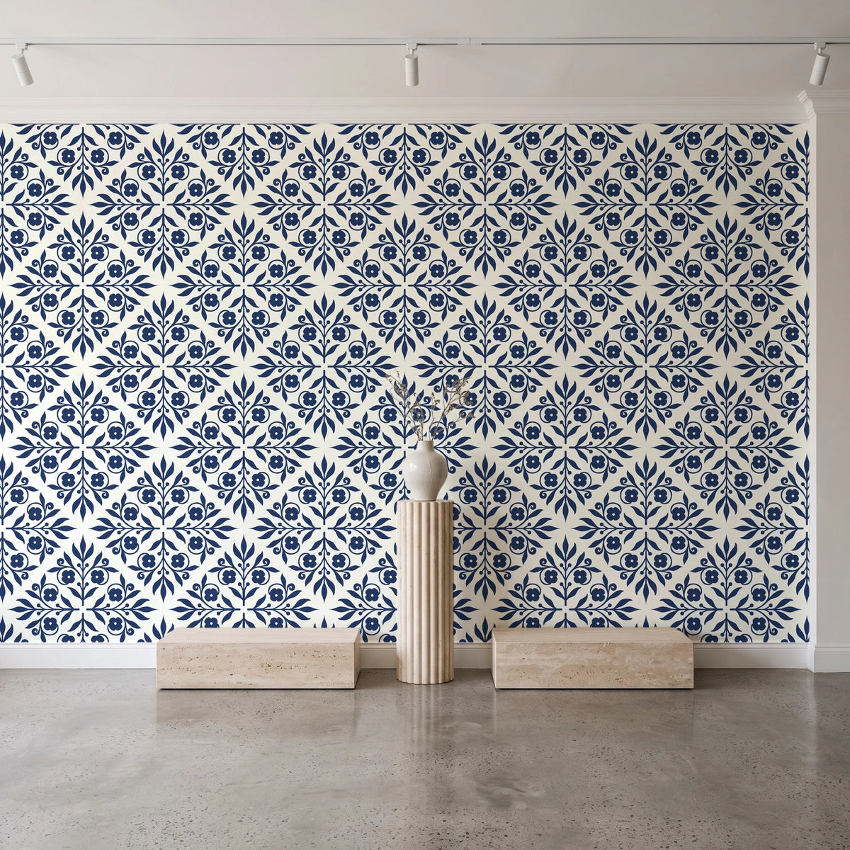 Soft Bouquet Opus Midnight floral damask wallpaper behind a travertine pedestal and vase in a minimal boutique