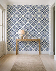 Soft Bouquet Opus Midnight floral damask wallpaper behind a console table in a light entry hallway