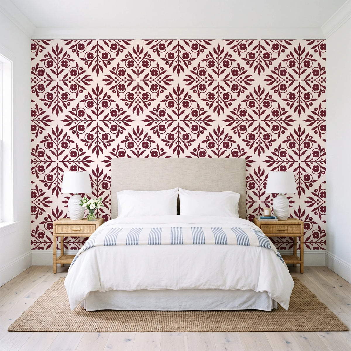 Soft Bouquet Opus Oxblood floral damask wallpaper behind a queen bed in a bright coastal bedroom