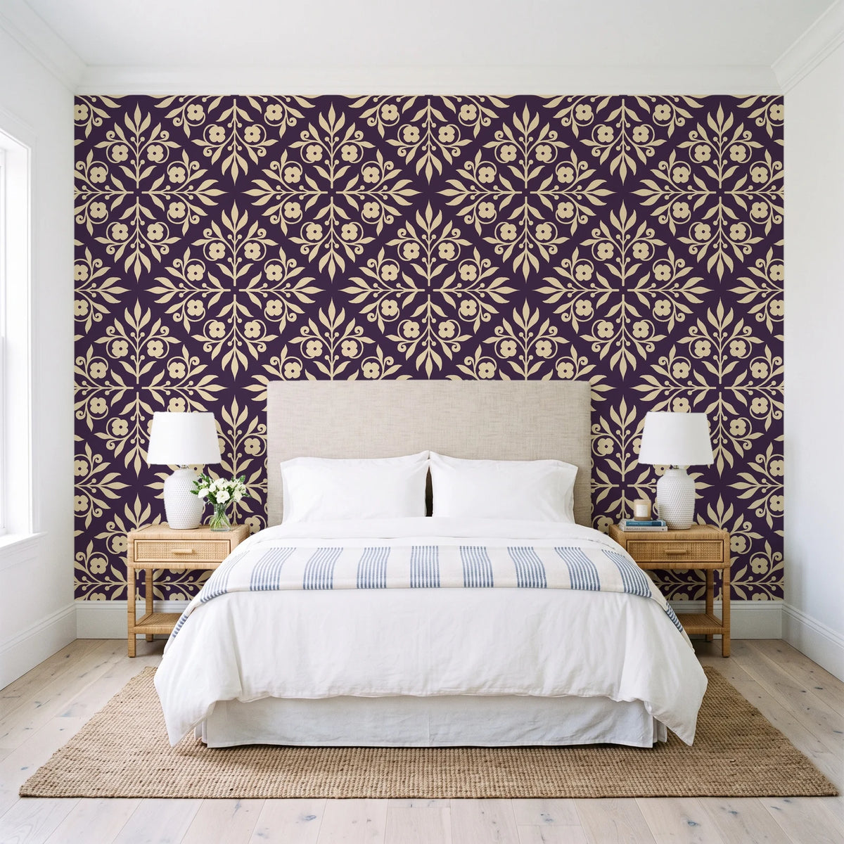 Soft Bouquet Opus Plum floral damask wallpaper behind a queen bed in a bright coastal bedroom