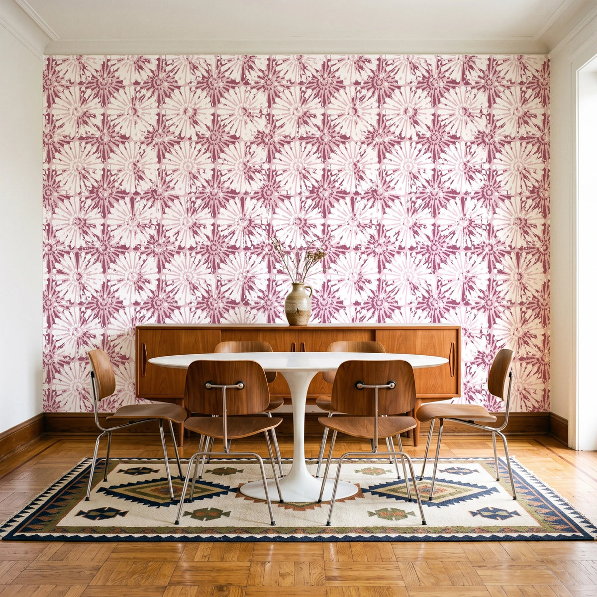 Solar Ritual Rosewood floral wallpaper in a mid-century dining room with a teak sideboard and tulip table