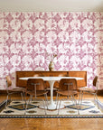 Solar Ritual Rosewood floral wallpaper in a mid-century dining room with a teak sideboard and tulip table