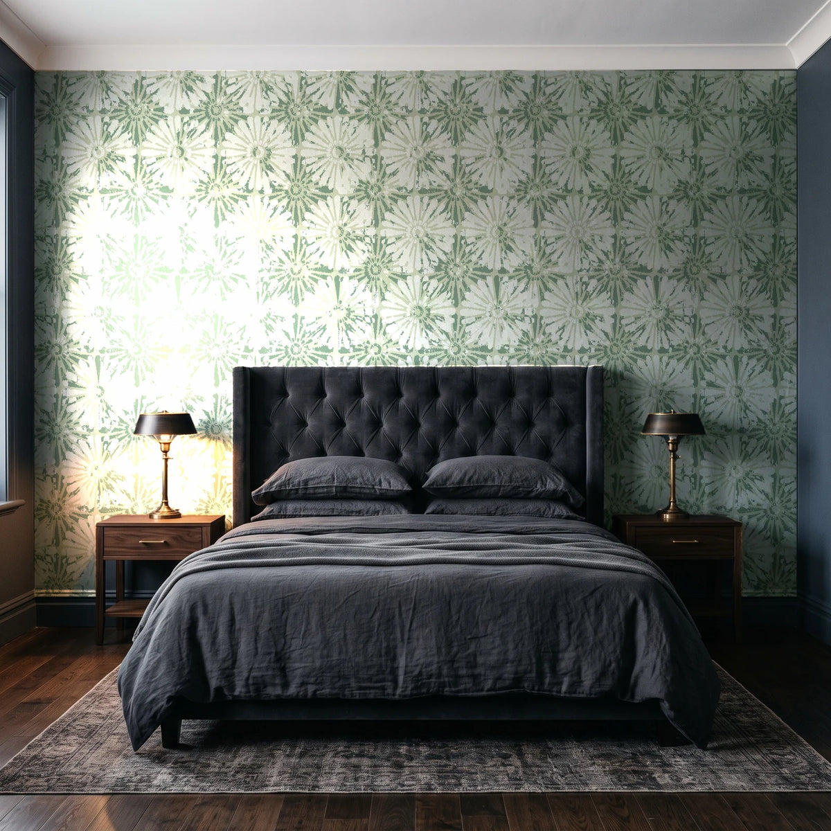 Solar Ritual Sage floral wallpaper behind a tufted headboard in a dark, moody bedroom