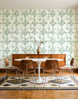 Solar Ritual Sage floral wallpaper in a mid-century dining room with a teak sideboard and tulip table