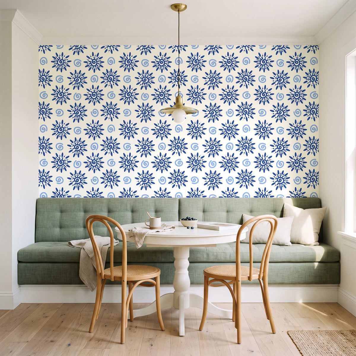 Solstice Bloom Cobalt folk sun wallpaper as a feature wall in a sunlit breakfast nook
