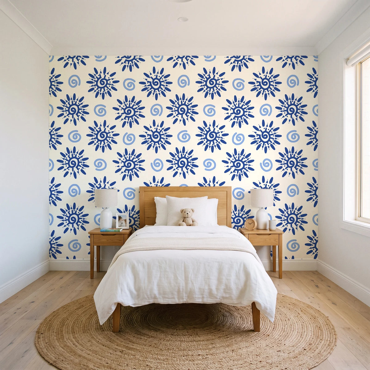 Solstice Bloom Cobalt folk sun wallpaper in a bright, cheerful child's bedroom