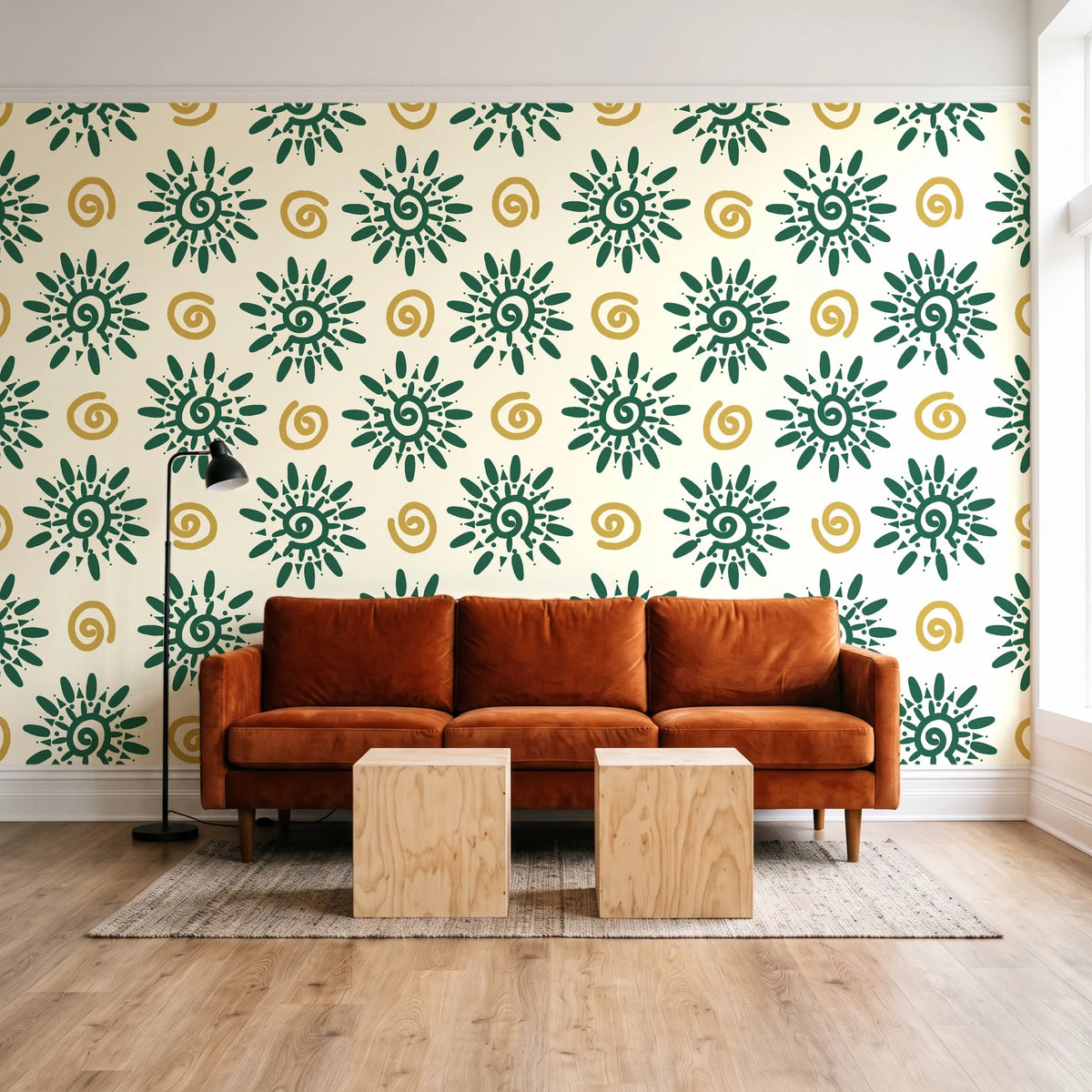 Solstice Bloom Emerald folk sun wallpaper behind a rust velvet sofa in a bright coworking lounge