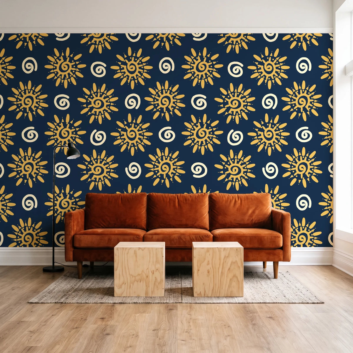 Solstice Bloom Midnight folk sun wallpaper behind a rust velvet sofa in a bright coworking lounge