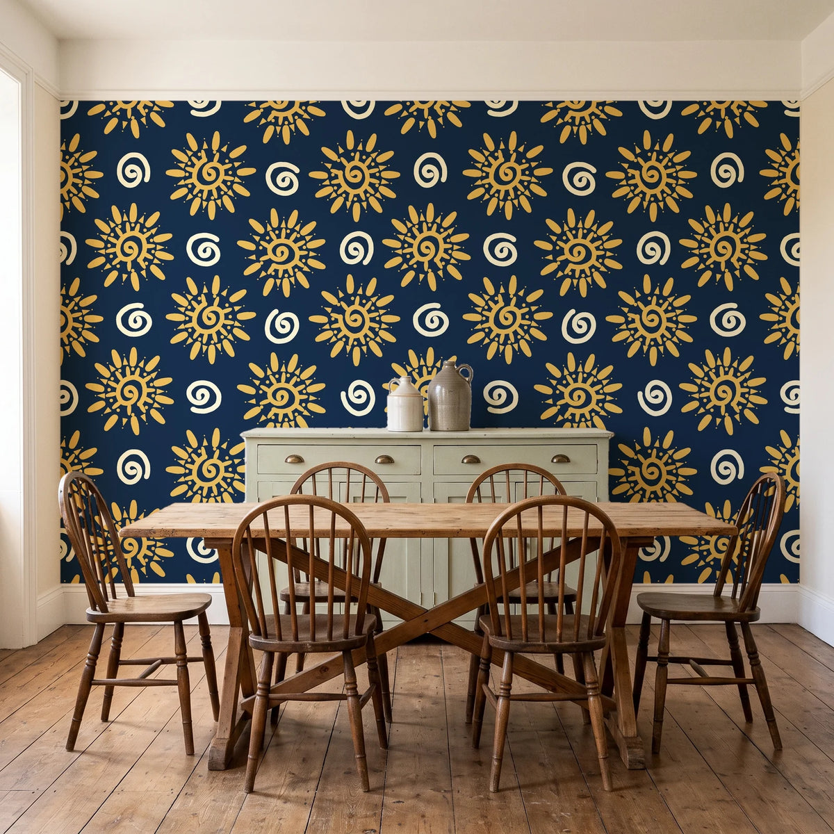 Solstice Bloom Midnight folk sun wallpaper in a farmhouse dining room with a sage sideboard and rustic trestle table