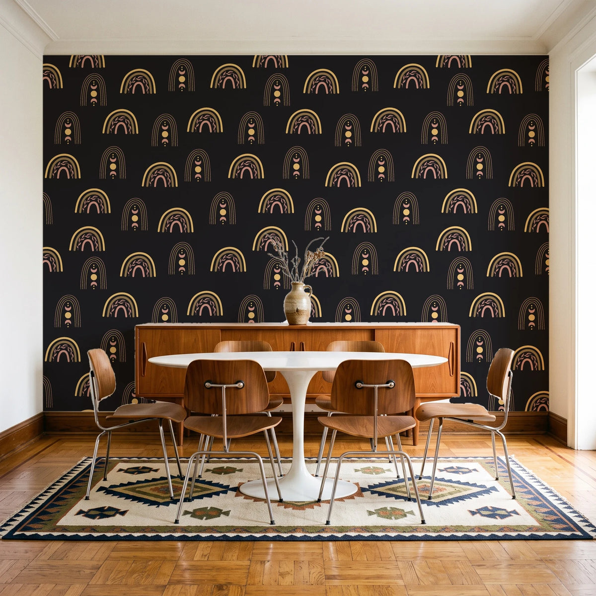 Solstice Rite Eclipse boho rainbow wallpaper in a mid-century dining room with a teak sideboard and tulip table