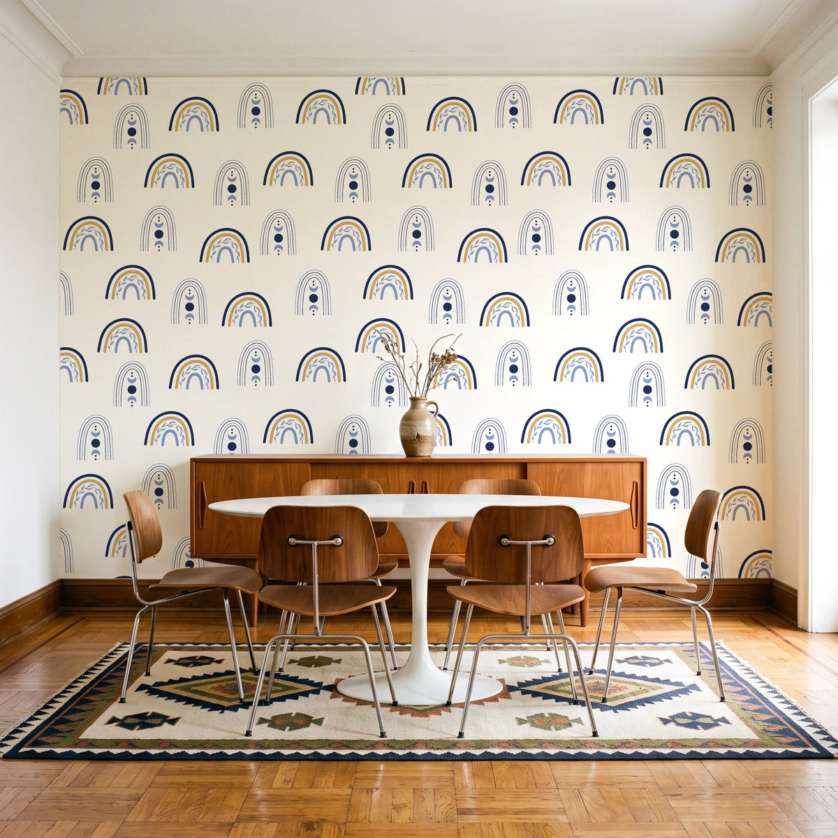 Solstice Rite Midnight boho rainbow wallpaper in a mid-century dining room with a teak sideboard and tulip table