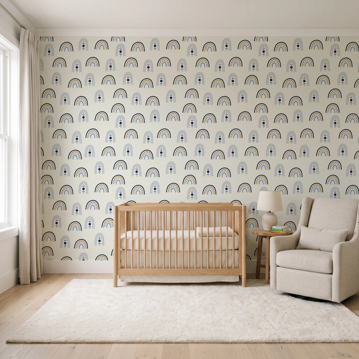 Solstice Rite Midnight boho rainbow wallpaper in a calm, light-filled nursery