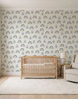 Solstice Rite Midnight boho rainbow wallpaper in a calm, light-filled nursery