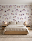 Solstice Rite Plum boho rainbow wallpaper behind a low platform bed in a serene Japandi bedroom