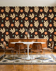 Spice & Frond Espresso leaf frond wallpaper in a mid-century dining room with a teak sideboard and tulip table