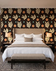 Spice & Frond Espresso leaf frond wallpaper behind the headboard of a king bed in a contemporary hotel guest room